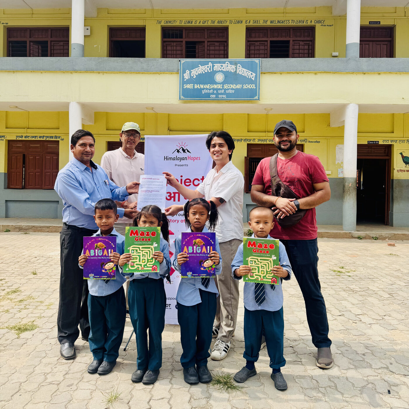 Students holding activity books at Shree Bhuwaneshwori Secondary School, Dhading