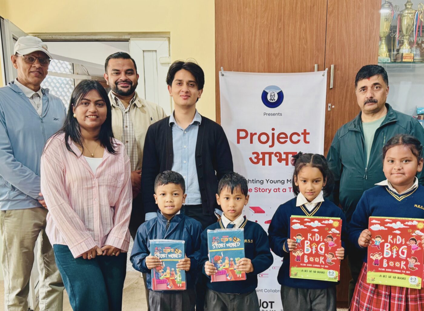Himalayan Hopes team and students with donated books at a Kathmandu school