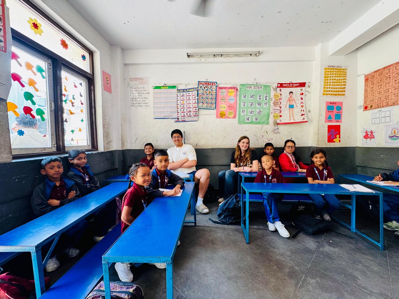 Students holding donated books in Lalitpur