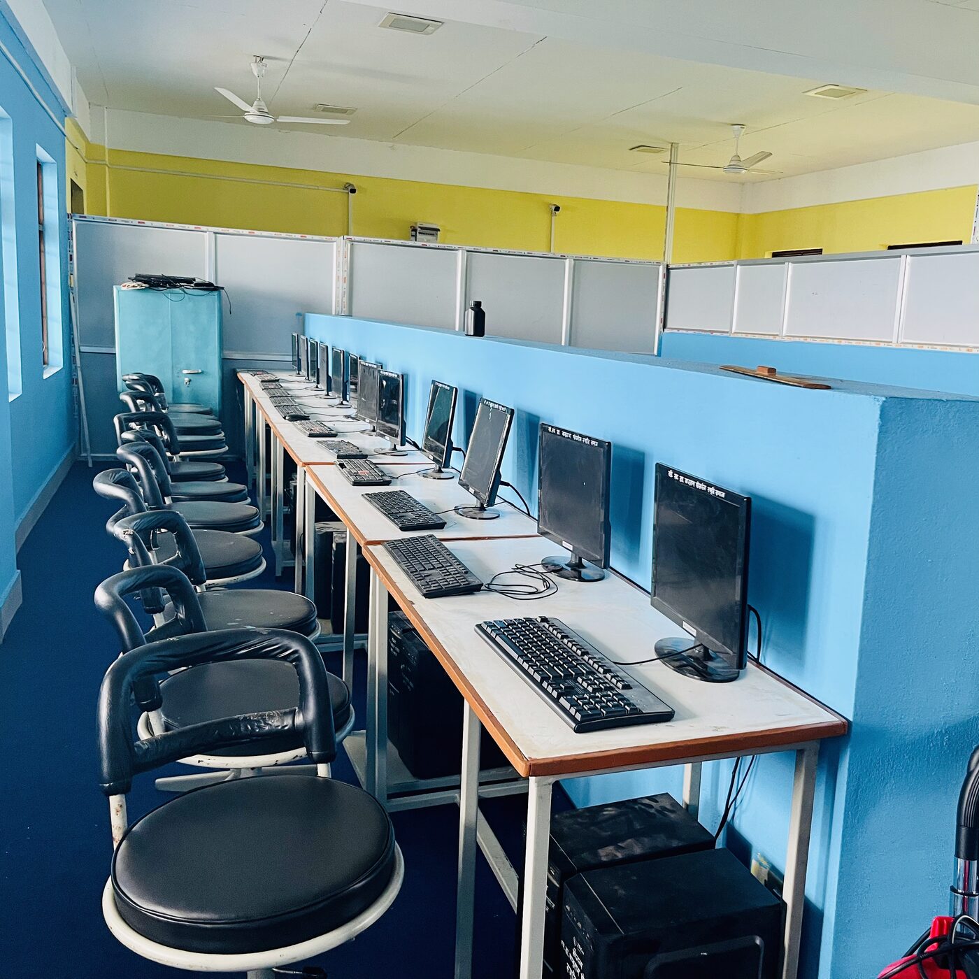 The computer lab at Shree Mandali Secondary School, rows of monitors and keyboards