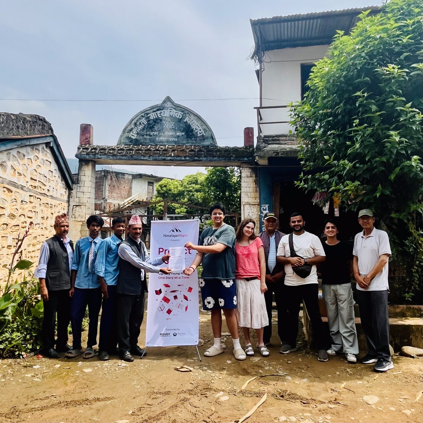 Himalayan Hopes team at the gate of a school in Gorkha