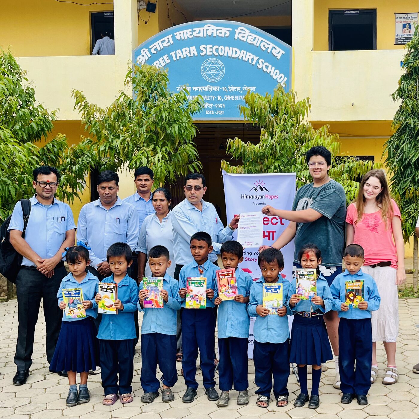 Students holding storybooks at Shree Tara Secondary School